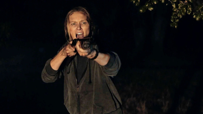 Michaela McManus as Irene pulling a gun in Redux Redux