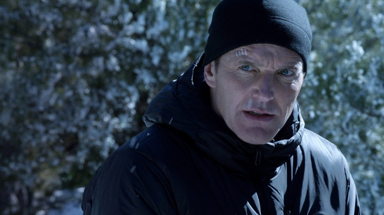 Agent Phil Coulson standing in the snow in Agents of S.H.I.E.L.D