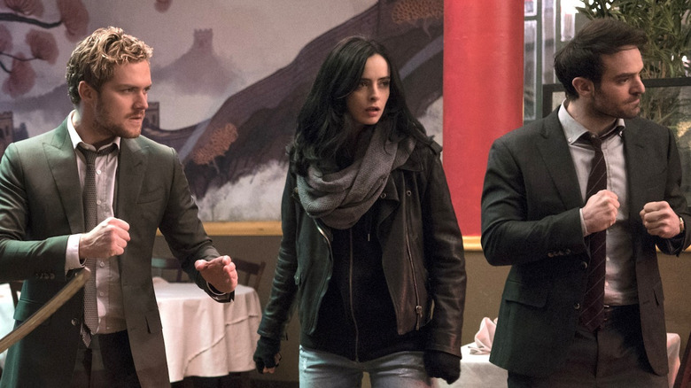 Finn Jones as Danny Rand, Krysten Ritter as Jessica Jones, and Charlie Cox as Matt Murdock on The Defenders