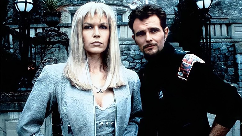 Emma Frost and Banshee, looking serious in front of a mansion, in the Generation X TV movie.