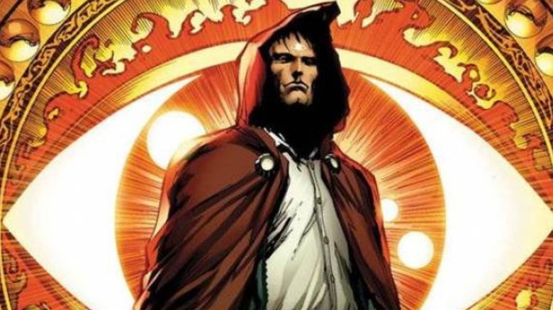 The Hood standing in front of the Eye of Agamotto