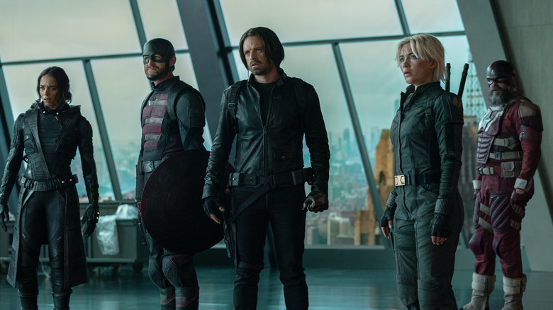 The Thunderbolts standing in a building with big windows in the background in Thunderbolts