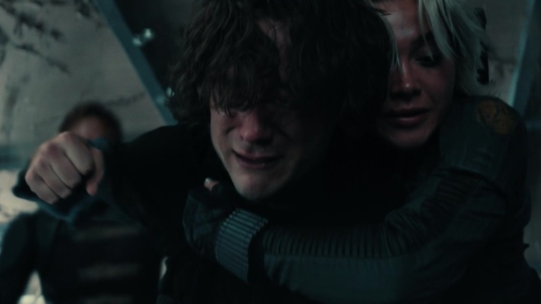 Lewis Pullman as Bob cries as Florence Pugh as Yelena Belova holds him from behind in Thunderbolts
