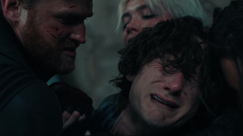 Lewis Pullman as Bob cries as Wyatt Russell as John Walker holds him in Thunderbolts