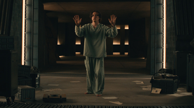 Lewis Pullman's Robert Reynolds raising his hands in Marvel's Thunderbolts