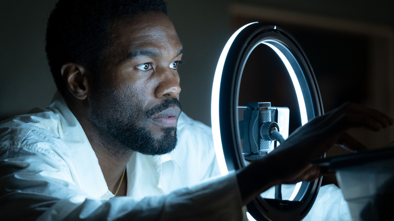 Simon Williams (Yahya Abdul-Mateen II) sets up his light for a self-tape audition in Wonder Man