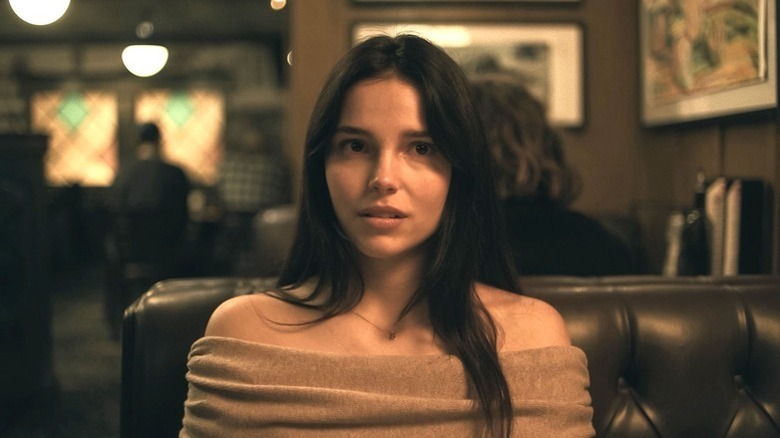 Nikki sitting at diner booth in Obsession