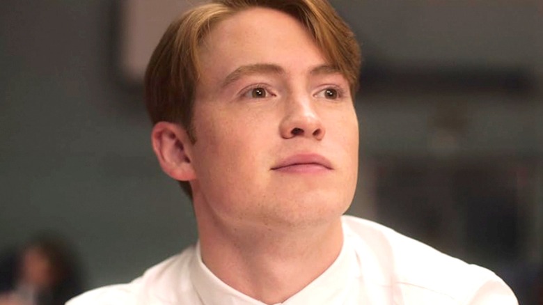 Kit Connor as Nick, looking at something off camera in Heartstopper