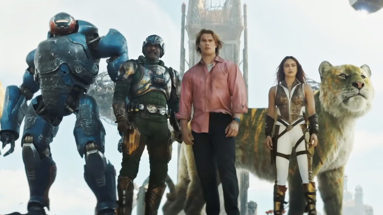Adam (Nicholas Galitzine), Duncan (Idris Elba), Teela (Camila Mendes), Roboto and Battle-Cat are ready to fight in Eternia in Masters of the Universe (2026)