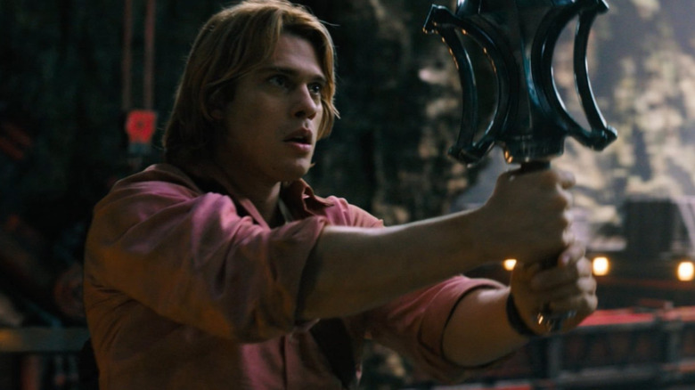 Adam holding the power sword in Masters of the Universe