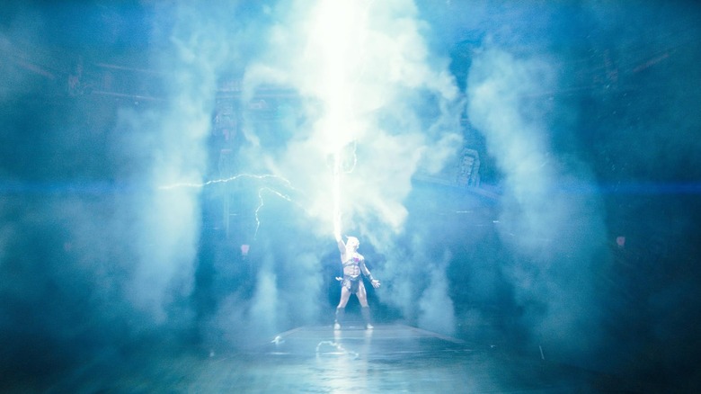 Adam firing a laser beam into the air with his sword in Masters of the Universe
