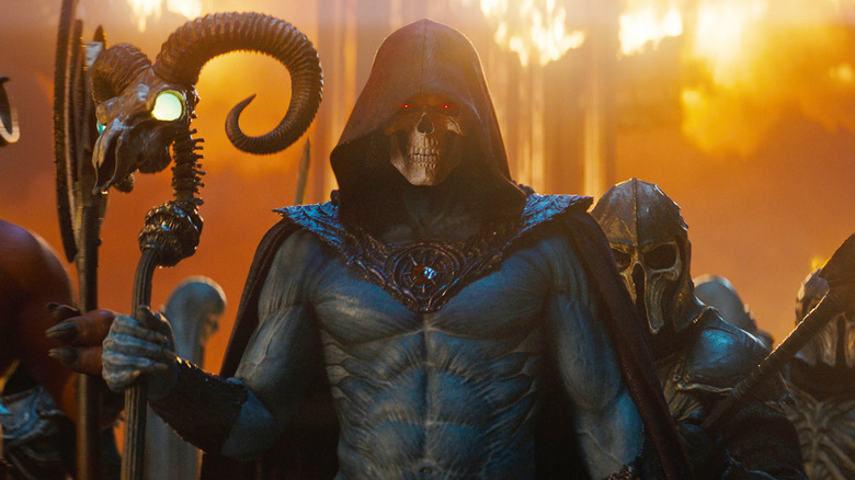 Skeletor and his minions in front of a burning castle in Masters of the Universe (2026)