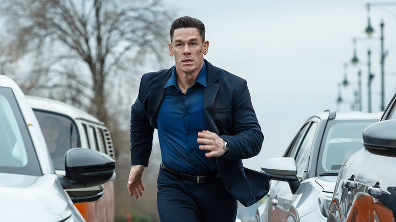 John Cena's Sean runs between cars outside in Matchbox The Movie