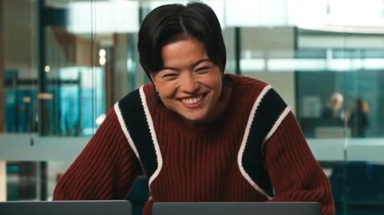 Piper Curda as Kira smiling over a computer on Matlock