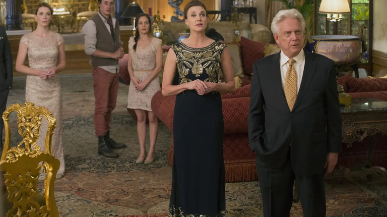 Several rich people are standing in a posh living room in The Leisure Class