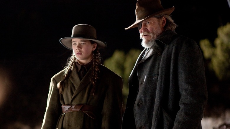 Hailee Steinfeld as Mattie Ross and Jeff Bridges as Rooster Cogburn in True Grit