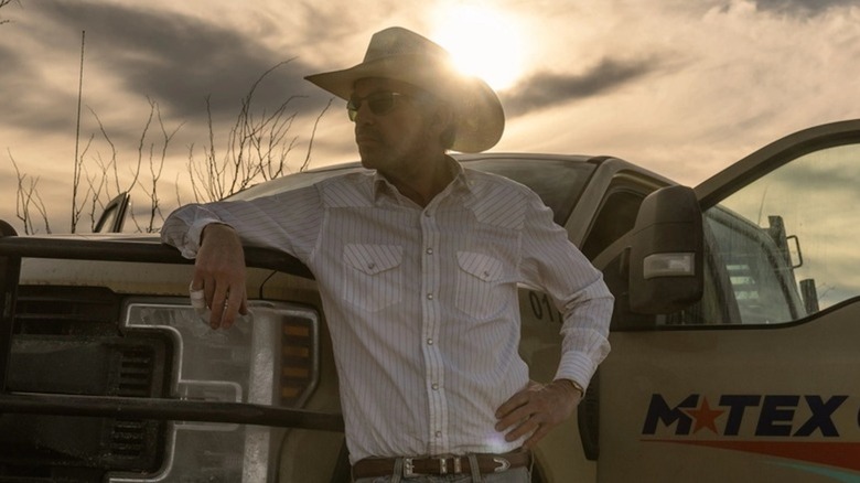 Billy Bob Thornton stands next to a truck as Tommy Norris in Landman