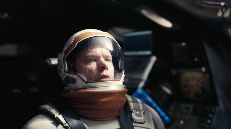 Matt Damon as Dr. Mann pilots a spacecraft in Interstellar