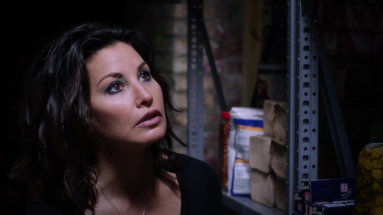 Sharla in a stocked basement in Killer Joe
