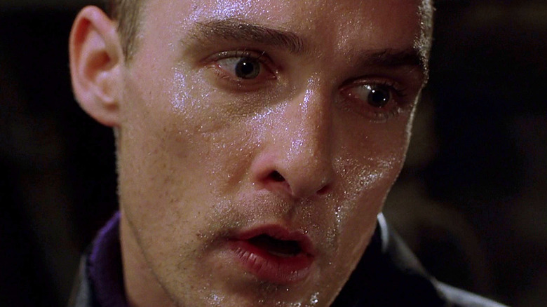 Matthew McConaughey as Andrew Taylor gasping while covered in moisture in U-571