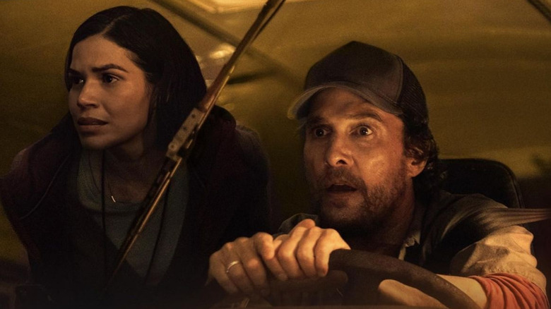 Mary and Kevin look alarmed at what they see as they drive The Lost Bus