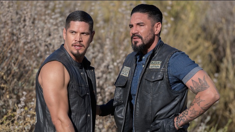 Two men standing biker jackets
