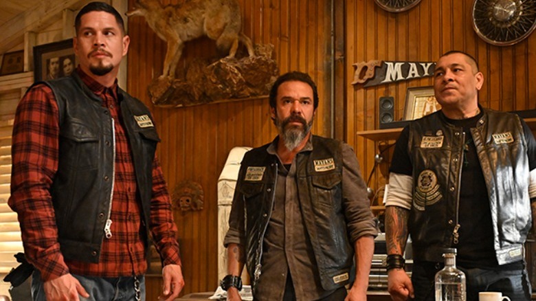 Three men standing biker jackets