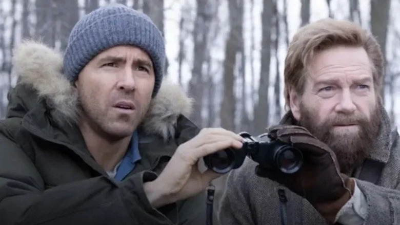 Troy (Ryan Reynolds) and Nilokai (Kenneth Branagh) sharing binoculars in Mayday