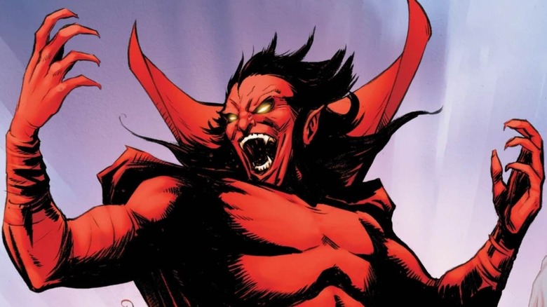 Mephisto with his hands up laughing