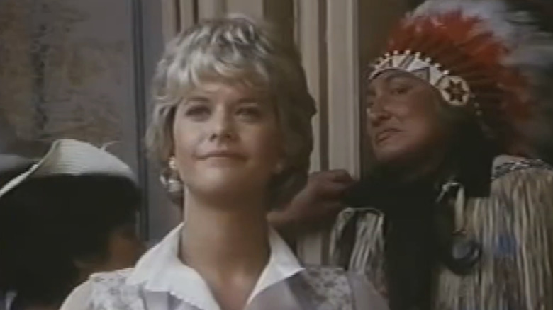 Meg Ryan as Cally Oaks standing next to a Native American in Wildside
