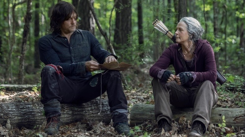 Norman Reedus and Melissa McBride's Daryl Dixon and Carol Peletier rest in the woods in "The Walking Dead"