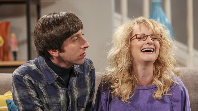 Bernadette crying on the couch with Howard looking at her on The Big Bang Theory