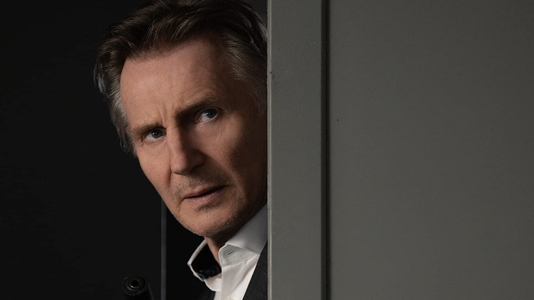 Liam Neeson looking concerned in Memory
