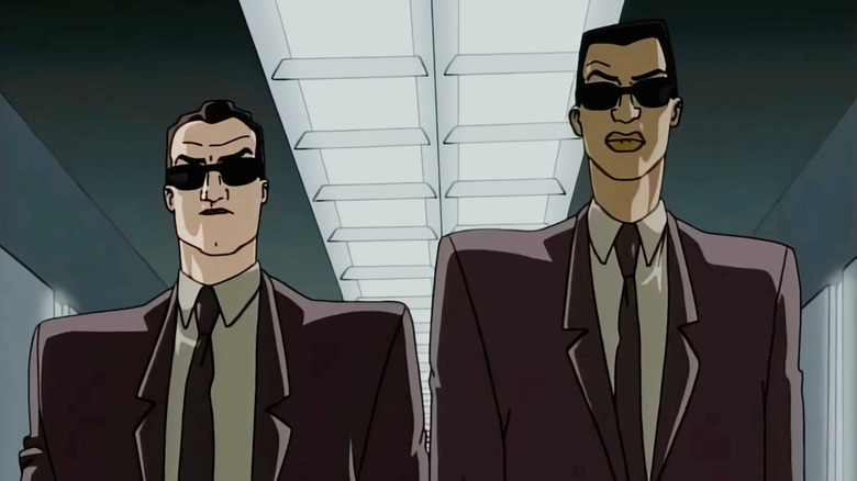 Agent K and Agent J walking down a hallway in Men in Black: The Series