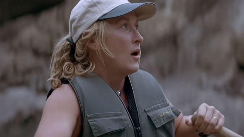 Meryl Streep's Gail Hartman looks worried as she steers a raft in The River Wild