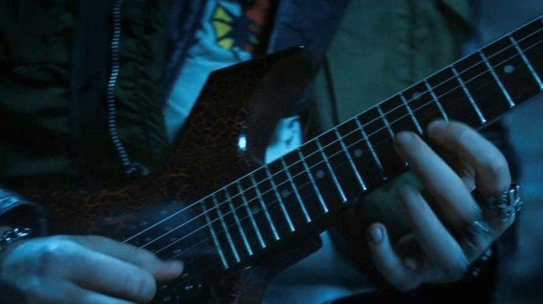 Eddie Munson shredding guitar in Stranger Things