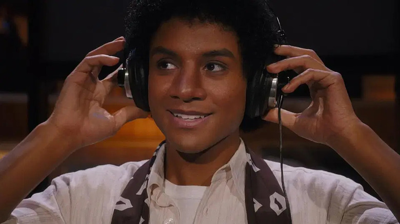 A young Michael Jackson wearing headphones in Michael