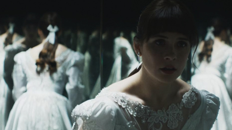 Judy Warren wearing a white dress in a room of mirrors in The Conjuring: Last Rites