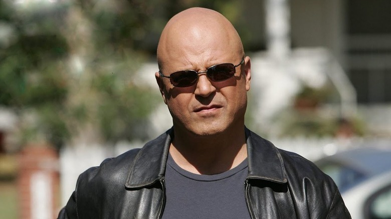 Medium close-up of VIC Mackey wearing sunglasses