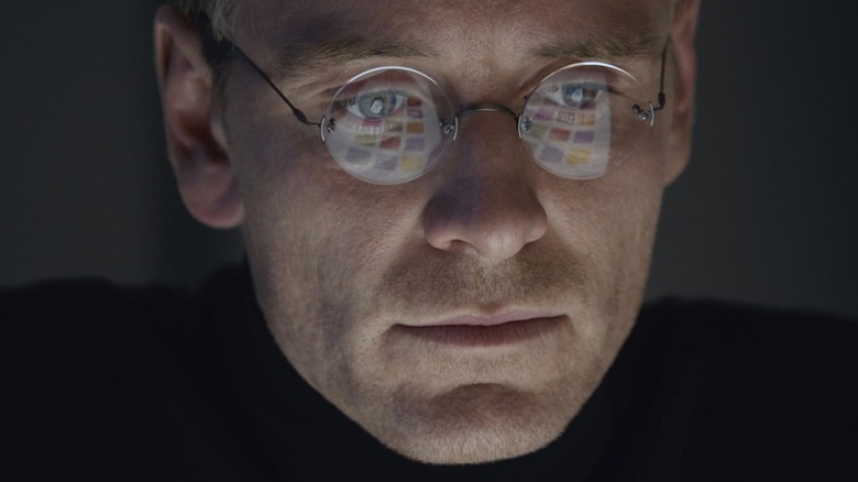 Close-up of Michael Fassbender as Steve Jobs in Steve Jobs (2015) with a computer keyboard reflected in his eyeglasses