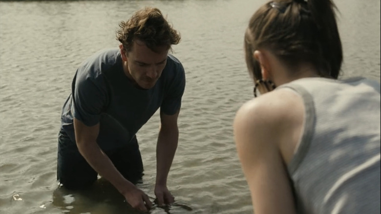 Michael Fassbender's Colin O'Reilly stands in a river with Katie Jarvis' Mia Williams in Fish Tank