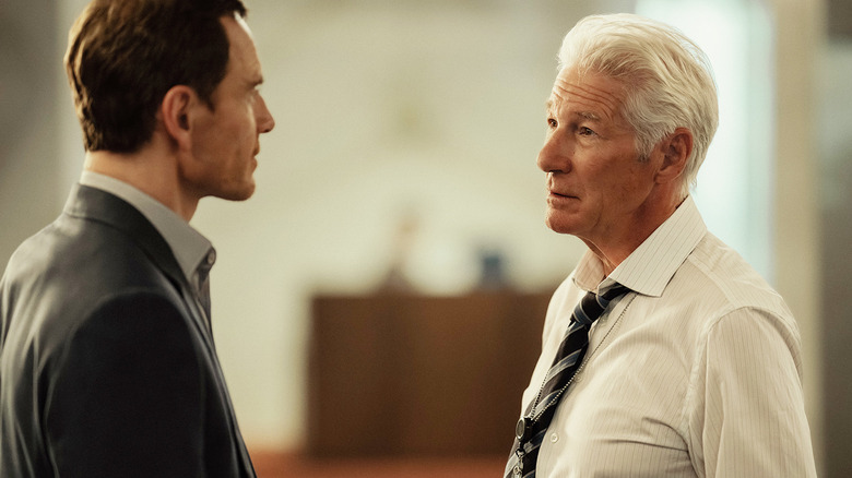 Michael Fassbender's Martian stands opposite Richard Gere's James Bradley in The Agency