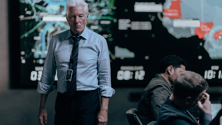 Richard Gere's James Bradley walks through his CIA office in The Agency