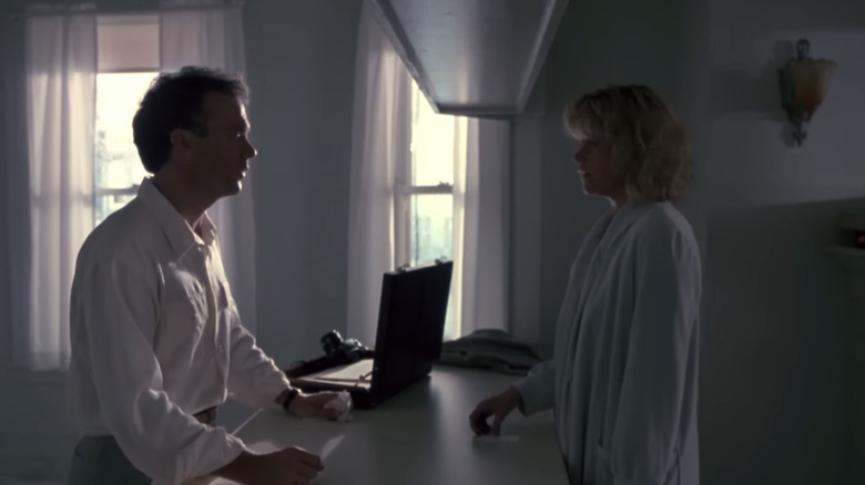 Michael Keaton's Carter Hayes stands opposite Melanie Griffith's Patricia Palmer in a house in Pacific Heights