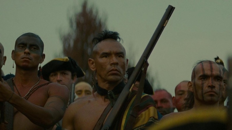 Last of the Mohicans Magua stands with soldiers