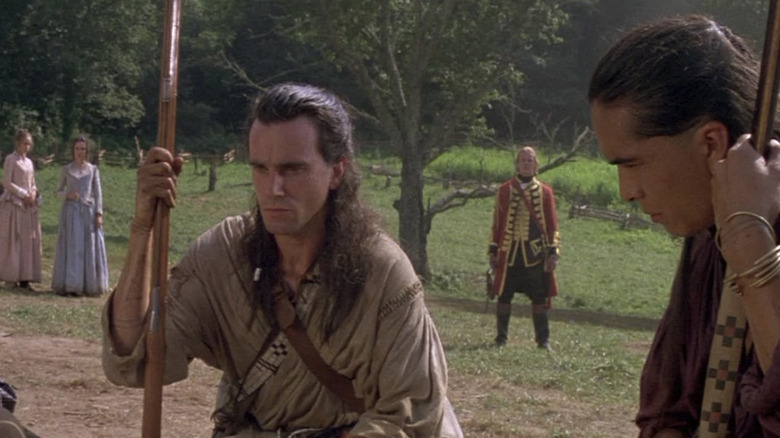 Daniel Day Lewis kneeling with a furrowed brow in The Last of the Mohicans