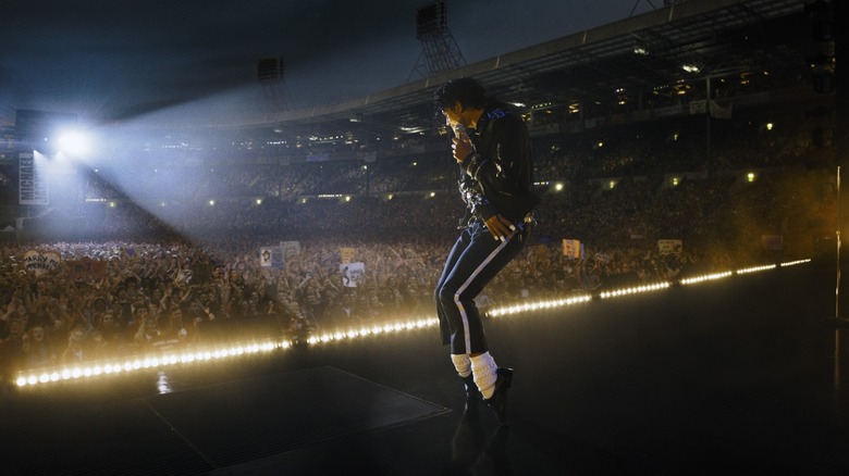 Jaafar Jackson as Michael Jackson dancing on stage during a packed concert in Michael