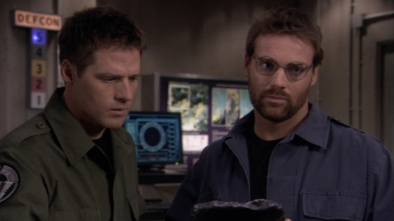 Ben Broder's Colonel Mitchell stands in an office at Stargate command in Stargate SG-1