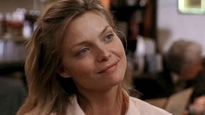 Franki, smiles at dinner in Frankie and Johnny