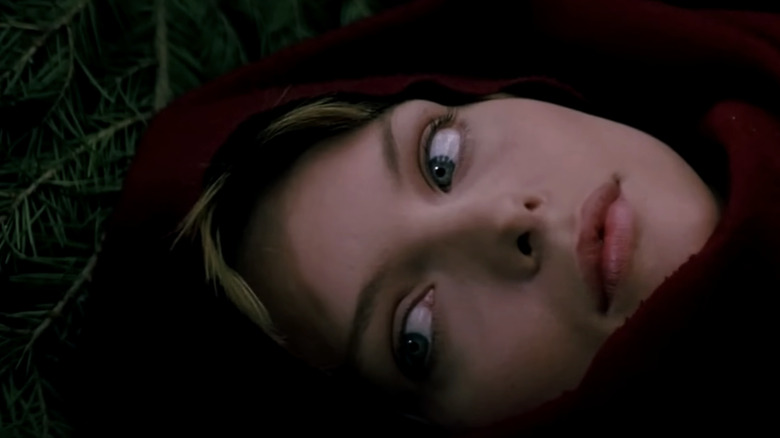 Michelle Pfeiffer's Isabeau of Anjou is shown laying down in closeup in Ladyhawke